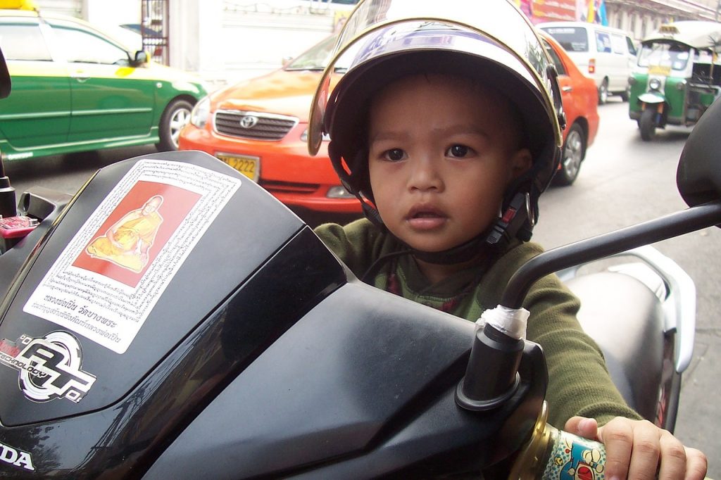 child driving motorcycle