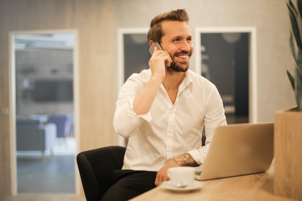 guy mobile laptop remote work