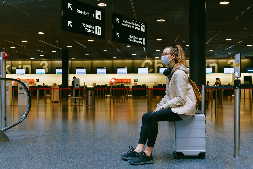 waiting at airport mask covid