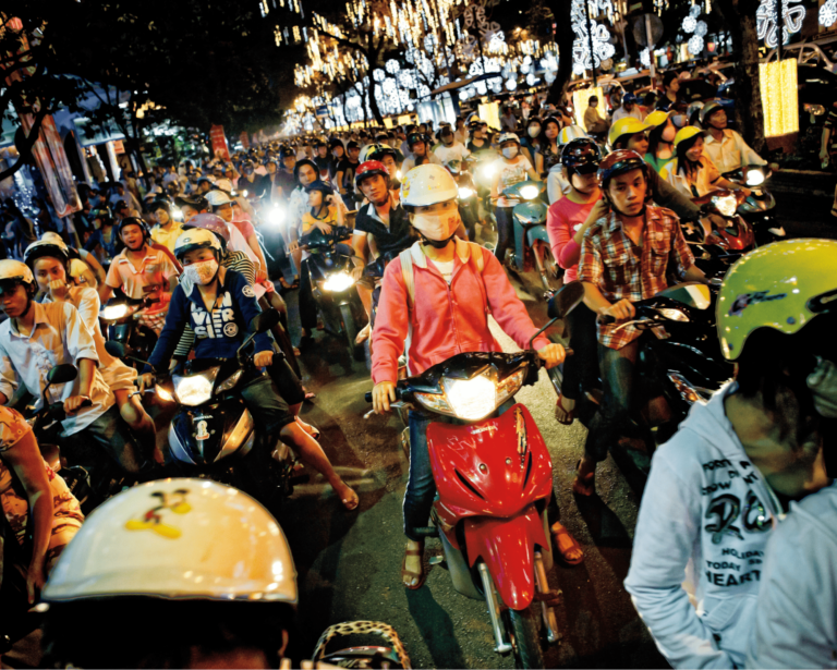 A sea of motorbikes wait at an intersection in Ho Chi Minh City